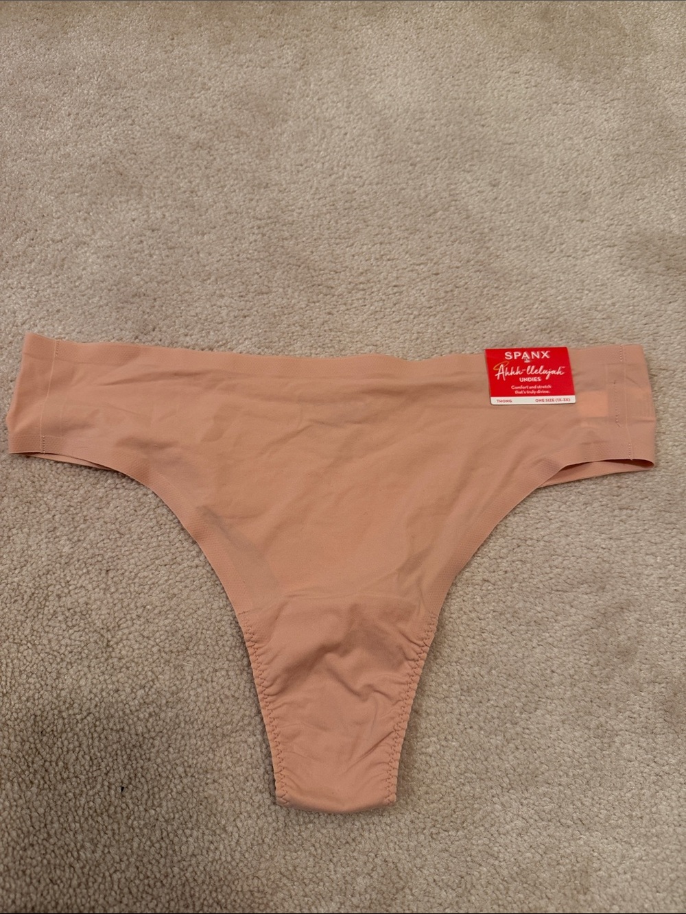 SPANX Women’s Nude Seamless Thong in Vintage Rose color. One size plus (1X-3X).